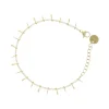 Bracelet doré et gouttes blanches