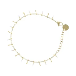 Bracelet doré et gouttes blanches
