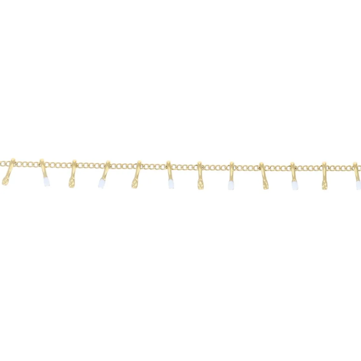 Bracelet doré et gouttes blanches