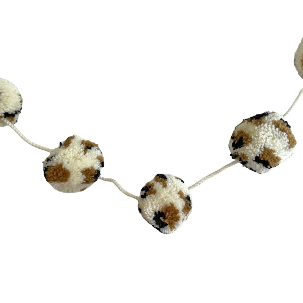 Guirlande à pompons léopard