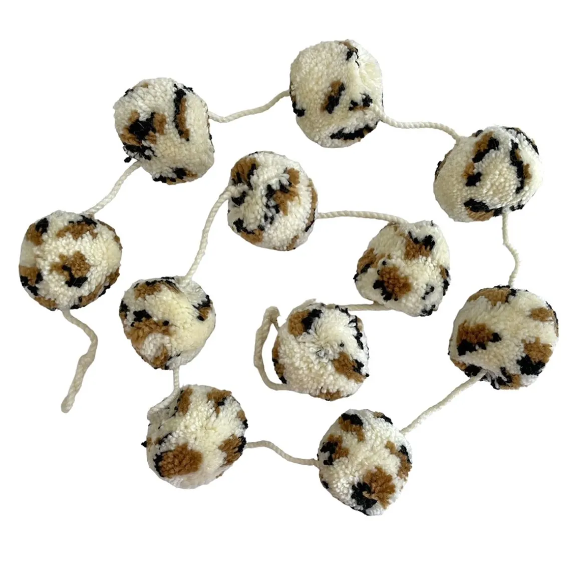 Guirlande à pompons léopard